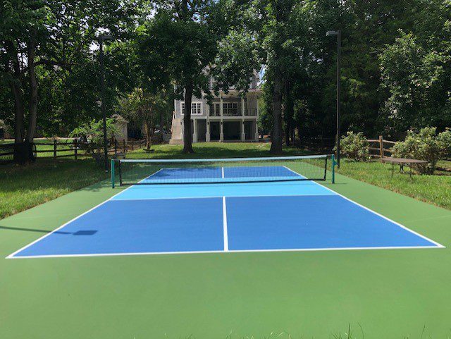 50′ x 100′ SnapSports Revolution Multi-Sport Court Surface - Happy Backyards